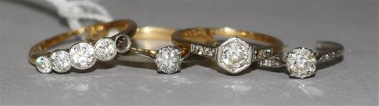 Four assorted gold and diamond rings (two a.f.).,